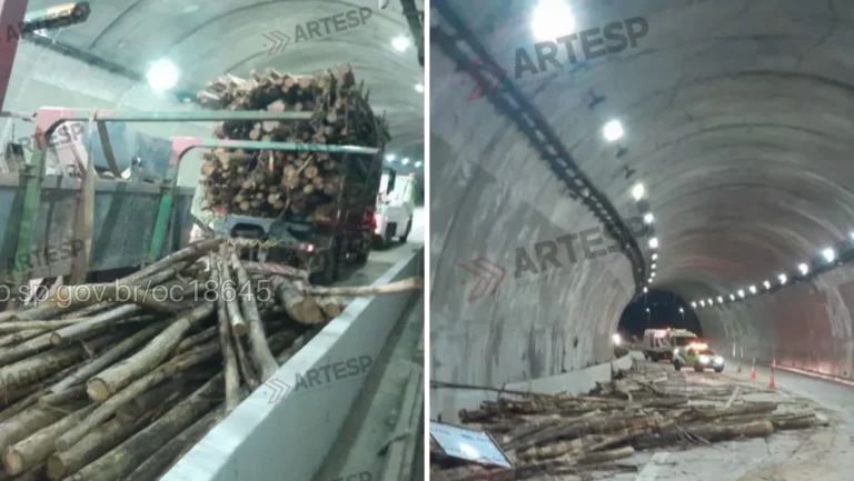 Caminhão bitrem tombado com madeira na Rodovia Carvalho Pinto em Jacareí