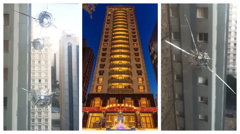 Vidros de hotel de luxo nos Jardins com perfurações de balas