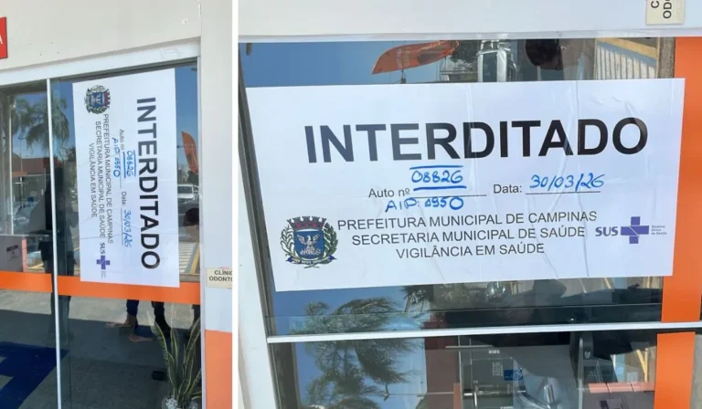 Sinal de interdição da Vigilância Sanitária em clínica odontológica da Faculdade Anhanguera, Campinas.
