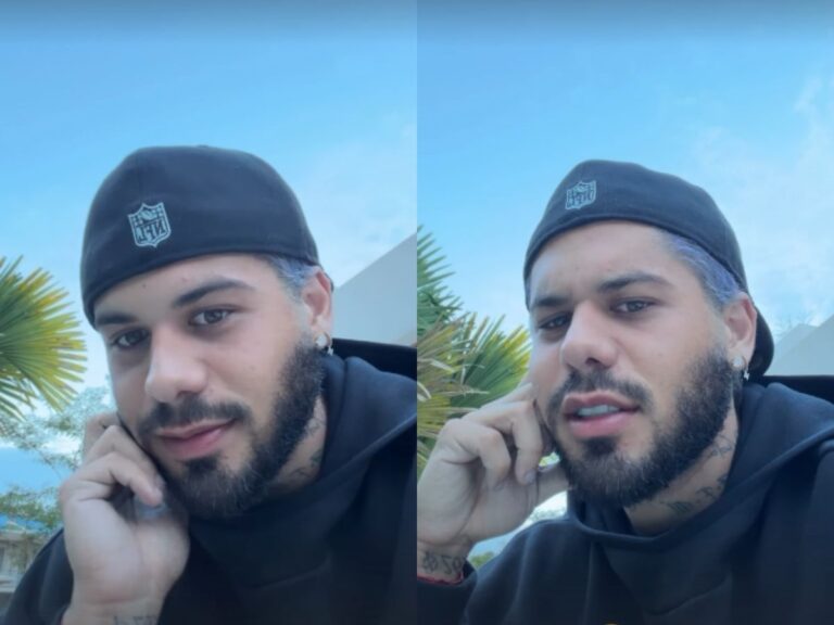 Zé Felipe no palco, cantando, com destaque para a interação sobre flores.