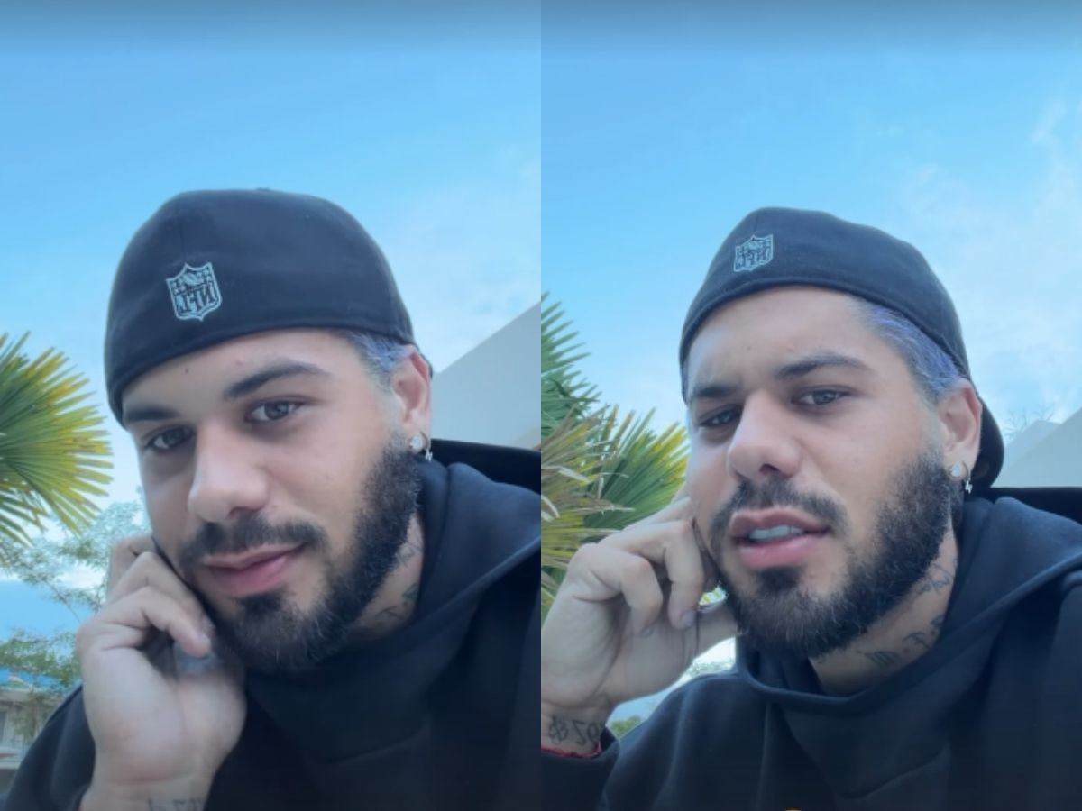 Zé Felipe no palco, cantando, com destaque para a interação sobre flores.