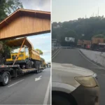 Carreta de mineração bloqueando portal de acesso em Itaperuna, causando lentidão no trânsito e a intervenção da Guarda Civil Municipal