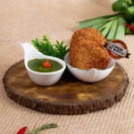 Petisco de verduras do Comida di Buteco Rio 2026 em mesa de bar