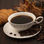 Xícara de café fumegante, grãos de café, ramo de cafeeiro, café especial