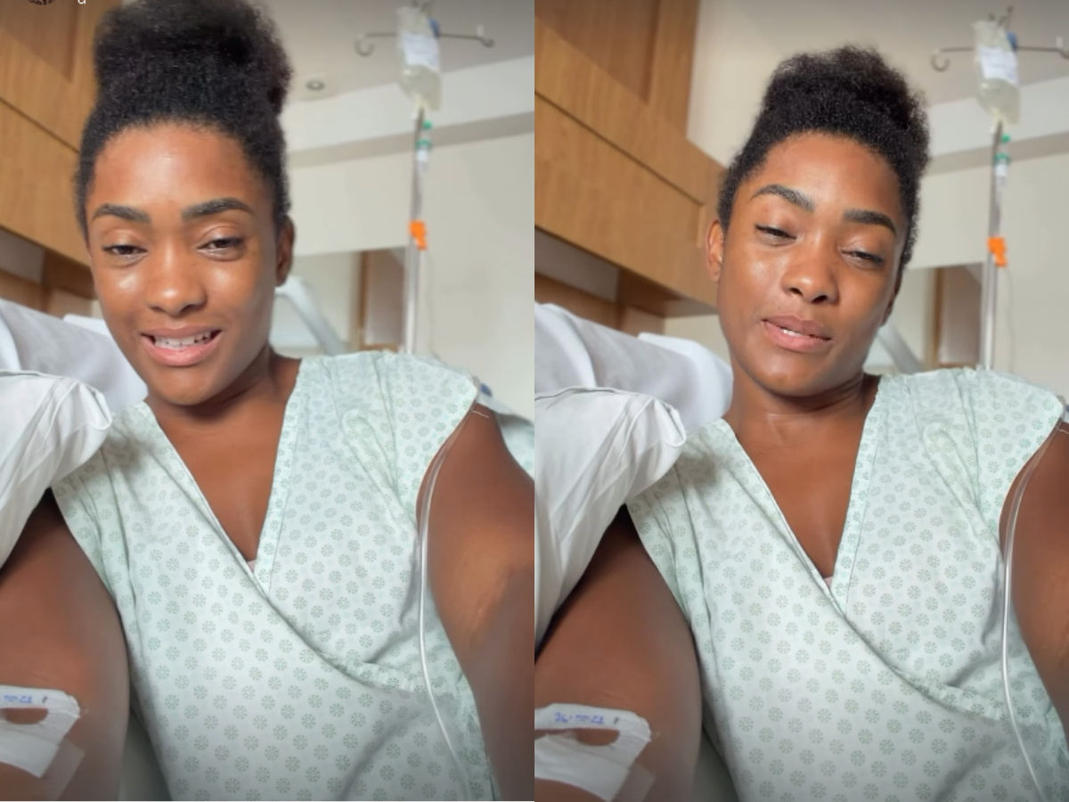 Erika Januza internada com infecção renal, segurando copo de água