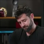 Oscar Schmidt, ex-jogador de basquete brasileiro, em um retrato que transmite serenidade e a memória de sua batalha contra o câncer.