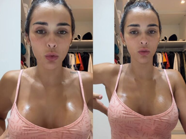 Mulher grávida com a mão no seio, expressando preocupação com nódulo na gravidez