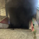 Incêndio em oficina Contagem, carros danificados, bombeiro, fumaça