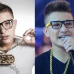 MC Gui cantando em palco iluminado, com microfone e expressão energética.