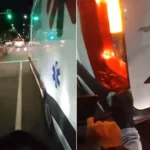 Motoboys empurrando ambulância com paciente em ponte de Cabo Frio durante a noite