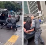 Mulher algemada por PMs na Avenida Paulista em São Paulo, com filha ao lado