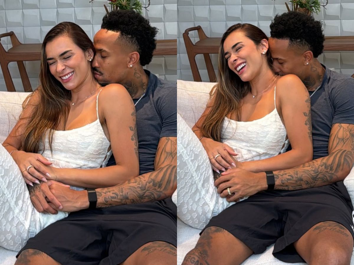 Éder Militão e Tainá Castro sorrindo com a imagem do ultrassom do filho Gabriel