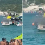 Embarcação em chamas controladas em Arraial do Cabo com equipe de resgate