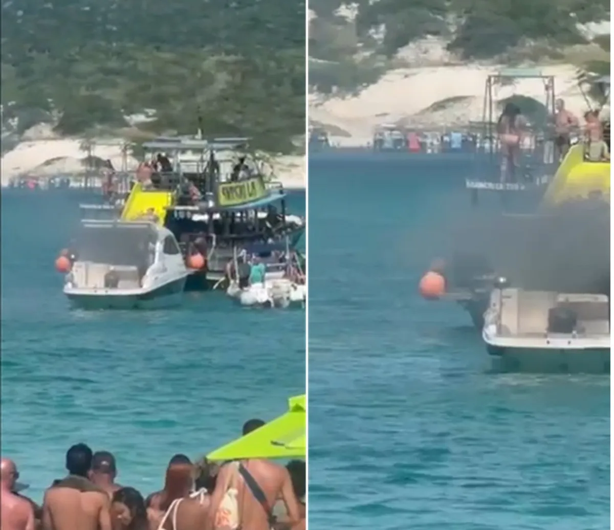 Embarcação em chamas controladas em Arraial do Cabo com equipe de resgate