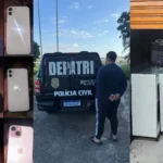 Pessoa furtando celular em show, área VIP, operação policial.