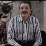 Amácio Mazzaropi sorrindo, com chapéu de caipira