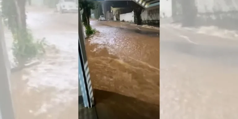 Carro submerso em rua alagada após chuva intensa em Tupã